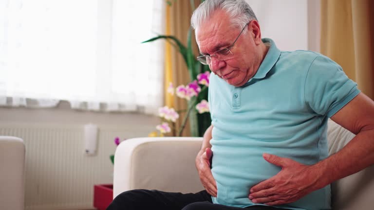 Senior man with stomach pain