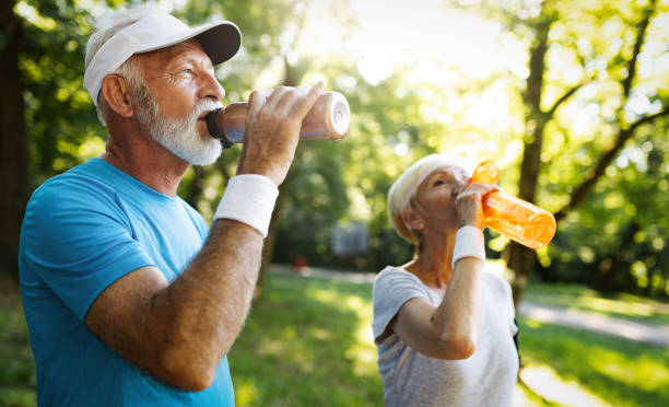 Couple drinking fluids and staying hydrated