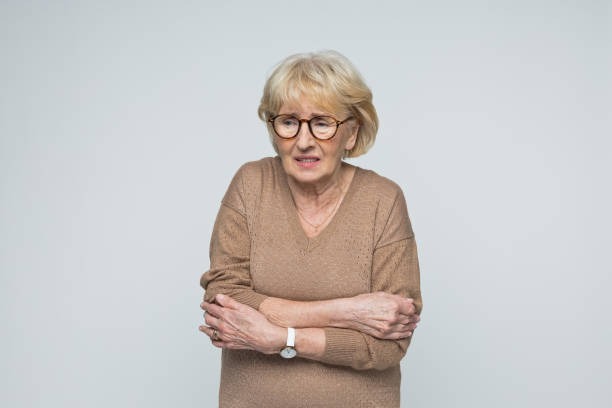 Senior woman in pain from chronic gas