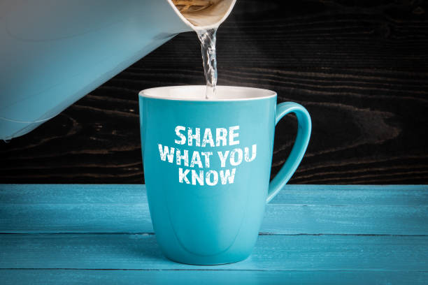 Share What You Know. Text on a blue coffee mug.
