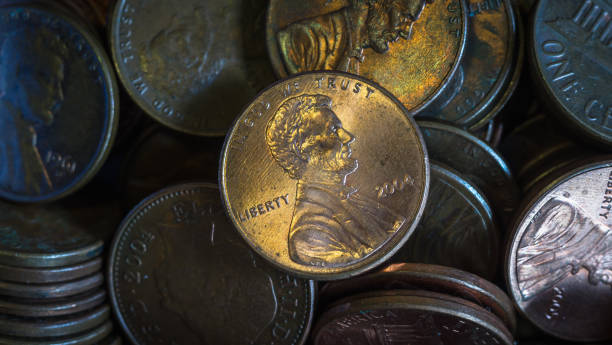 Close up one cent coin on coins pile